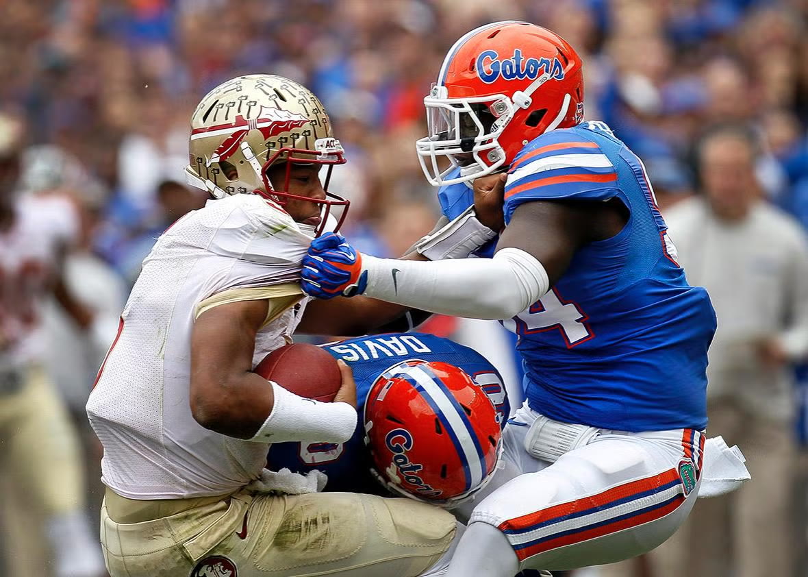 Florida football rivalry action between the two schools' teams